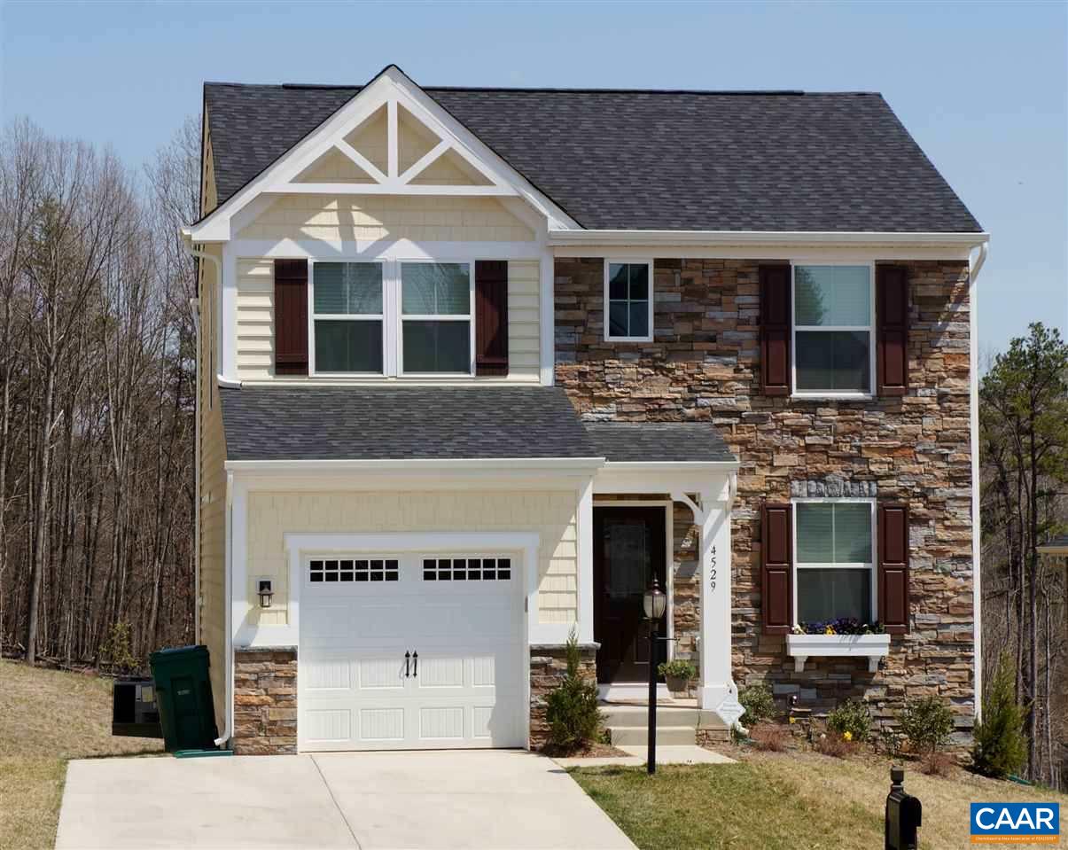 a front view of a house with garage