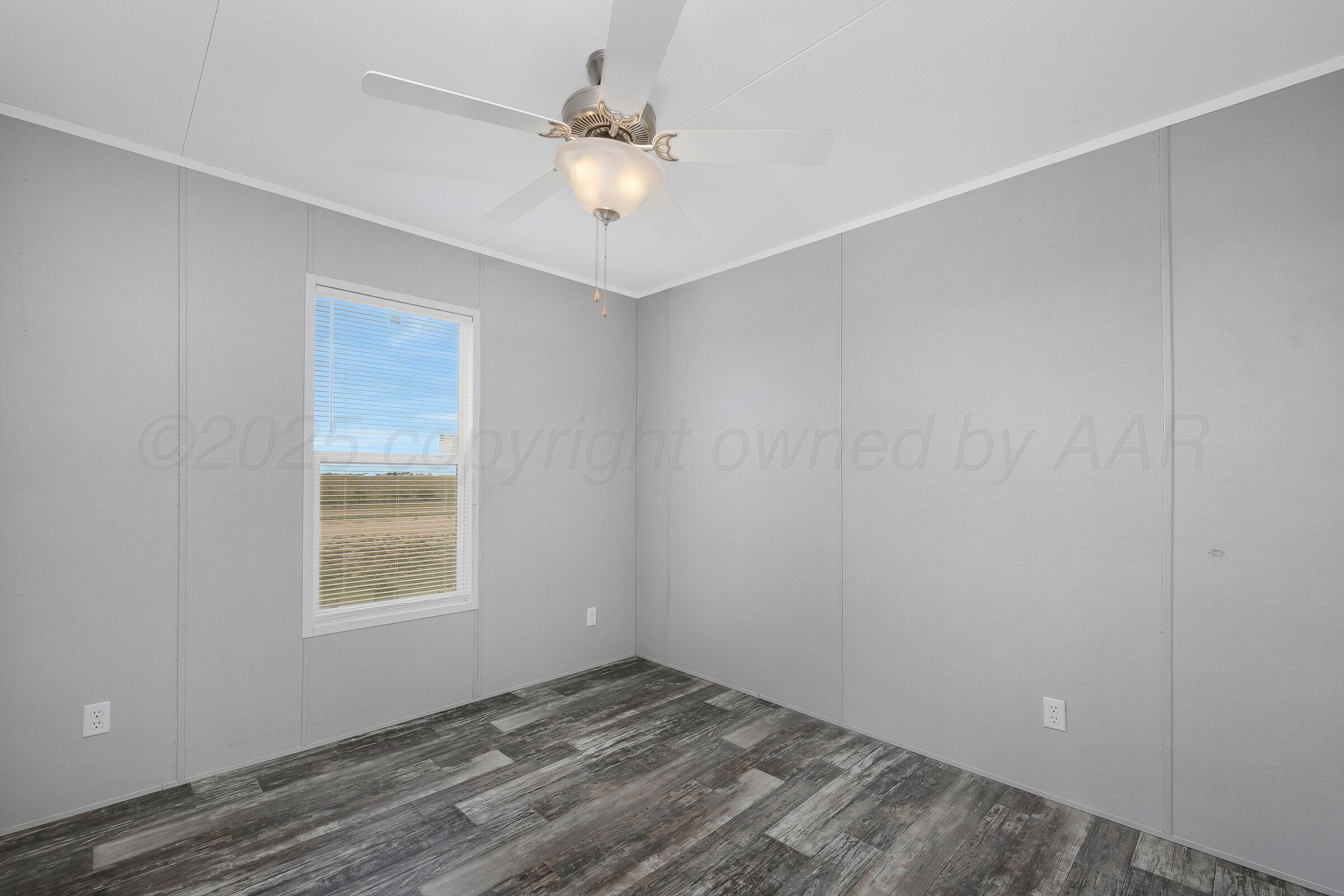 7979 Juett Attebury Road Amarillo, TX 79118 - Photo 16 of 22 an empty room with a window
