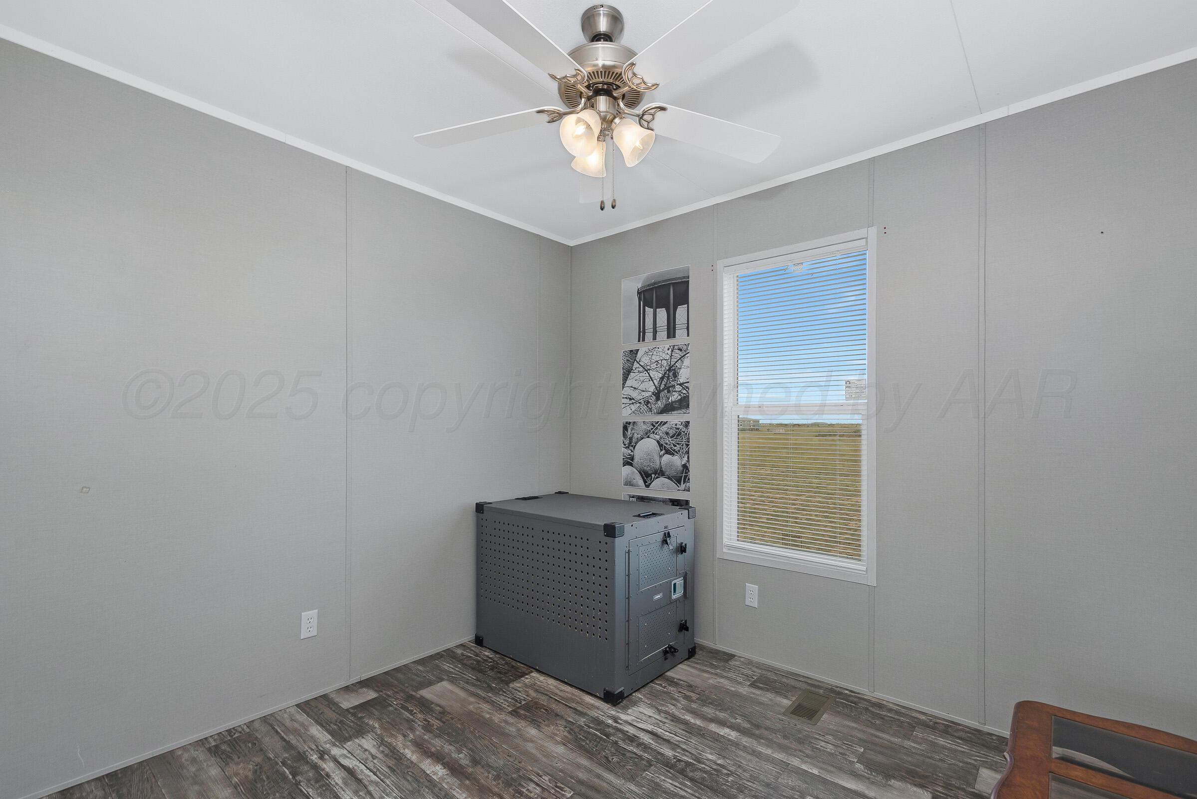 7979 Juett Attebury Road Amarillo, TX 79118 - Photo 19 of 22 a view of an empty room with a window