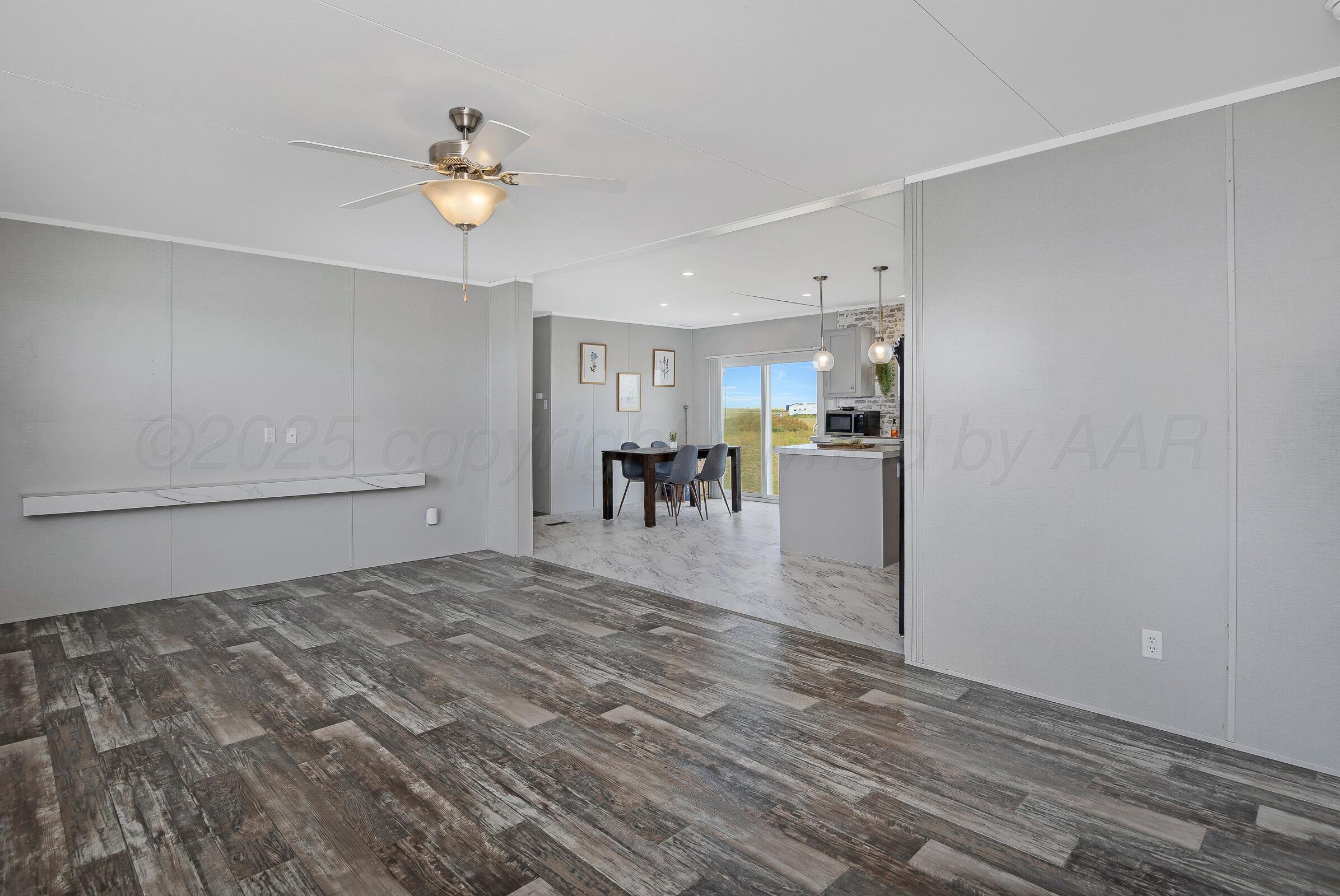 7979 Juett Attebury Road Amarillo, TX 79118 - Photo 4 of 22 a view of a livingroom with furniture and chandelier fan