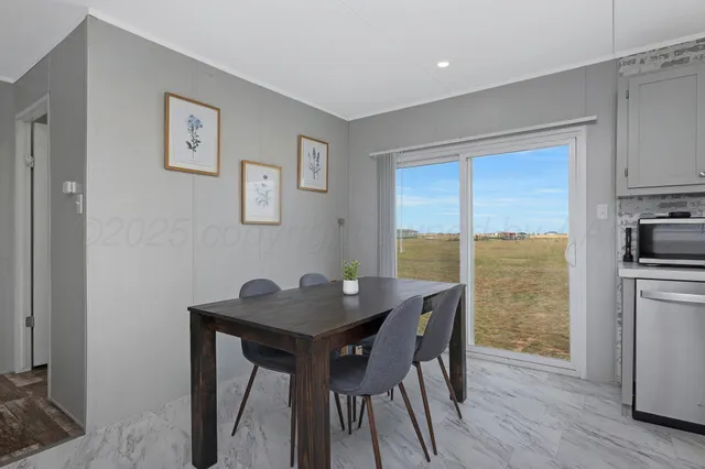 a dining room with furniture and wooden floor