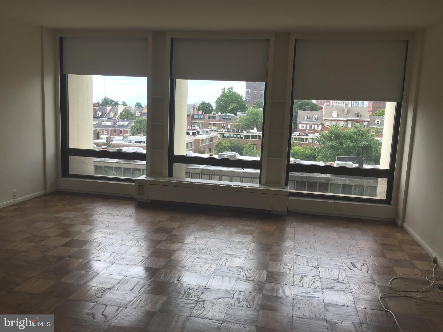 a view of a floor to ceiling window in an empty room