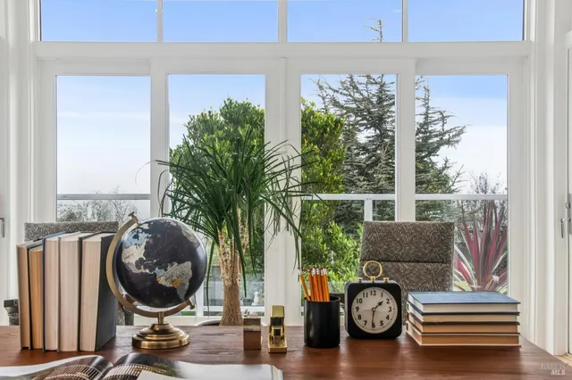 a view of livingroom with furniture and windows