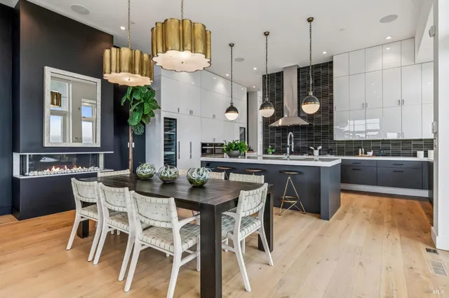 a kitchen with a table and chairs in it