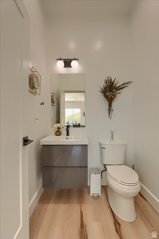 828 South Deer Road Tooele, UT 84074 - Photo 17 of 51 Powder room featuring a floating vanity with a gray finish, integrated sink, and matte black faucet