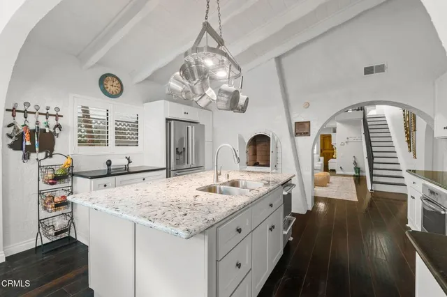 a view of living room with granite countertop furniture and fireplace