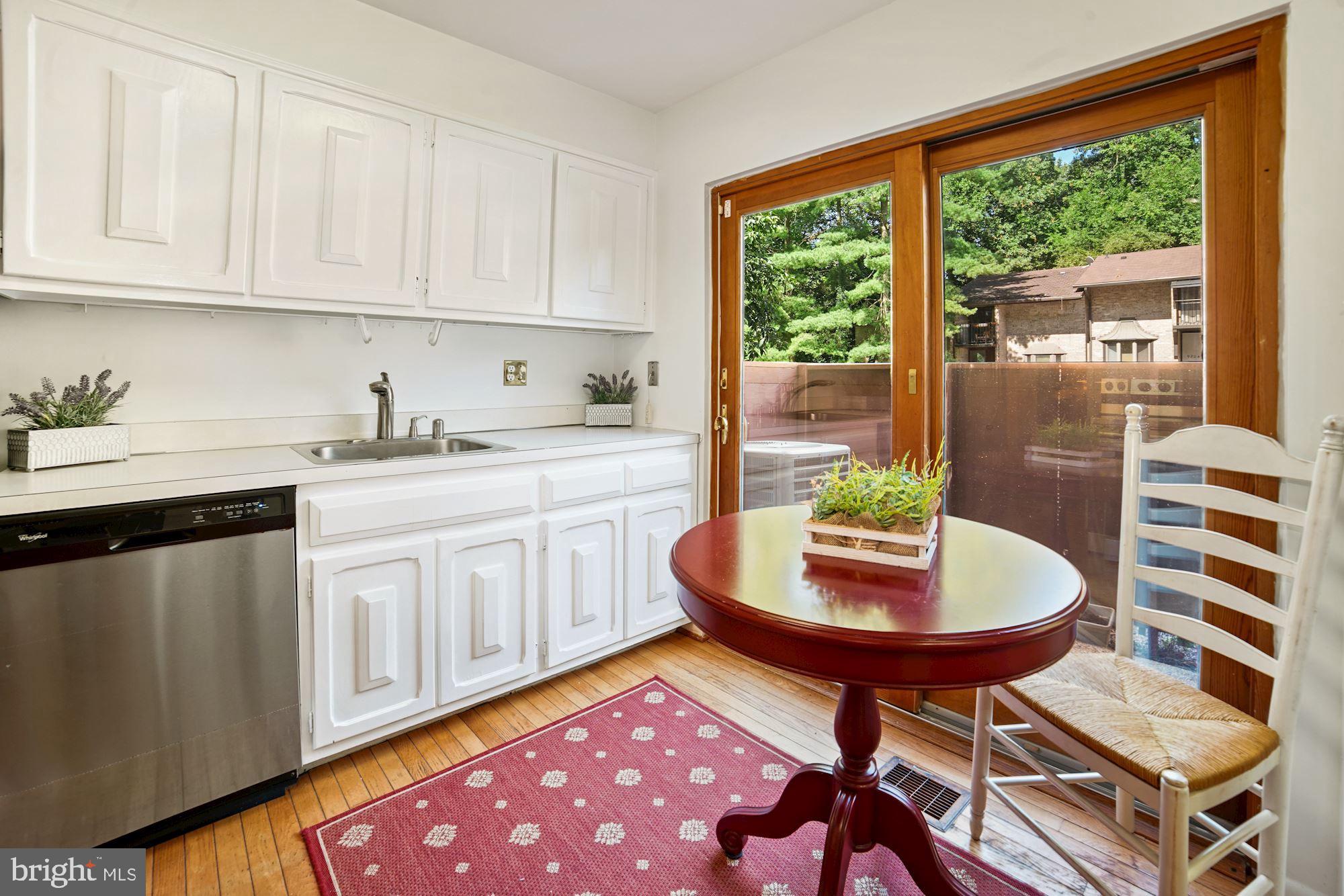 9205 Three Oaks Drive Silver Spring, MD 20901 - Photo 6 of 30 Sliding door from kitchen to the front patio
