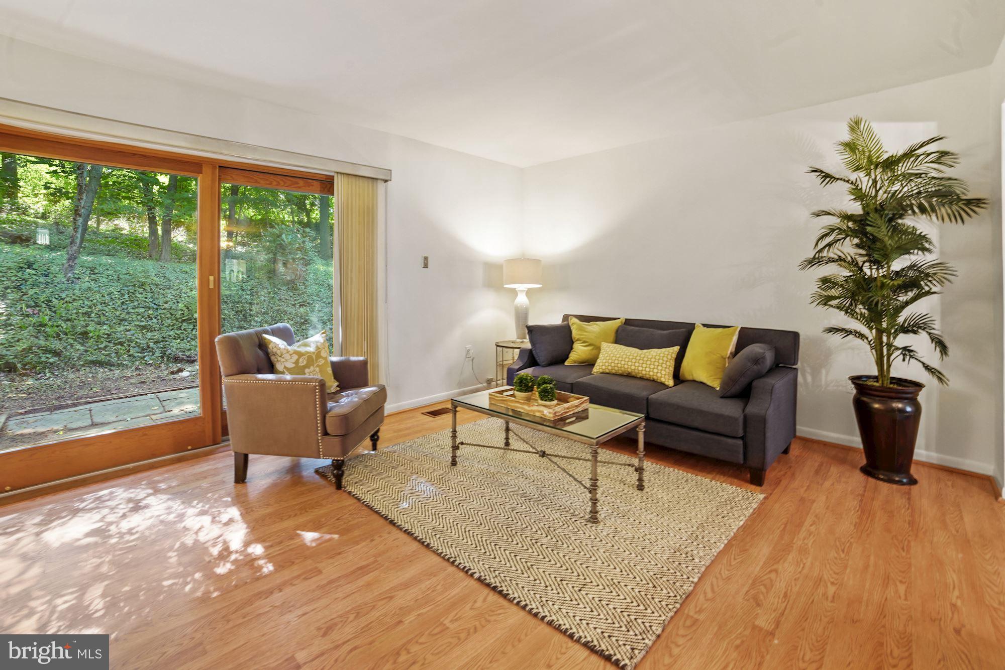 9205 Three Oaks Drive Silver Spring, MD 20901 - Photo 9 of 30 Living room open to the back patio