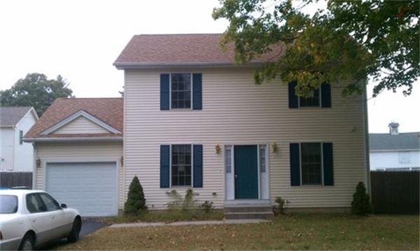 1195 Allen Street Springfield, MA 01118 - Photo 1 of 1 a front view of a house with a yard