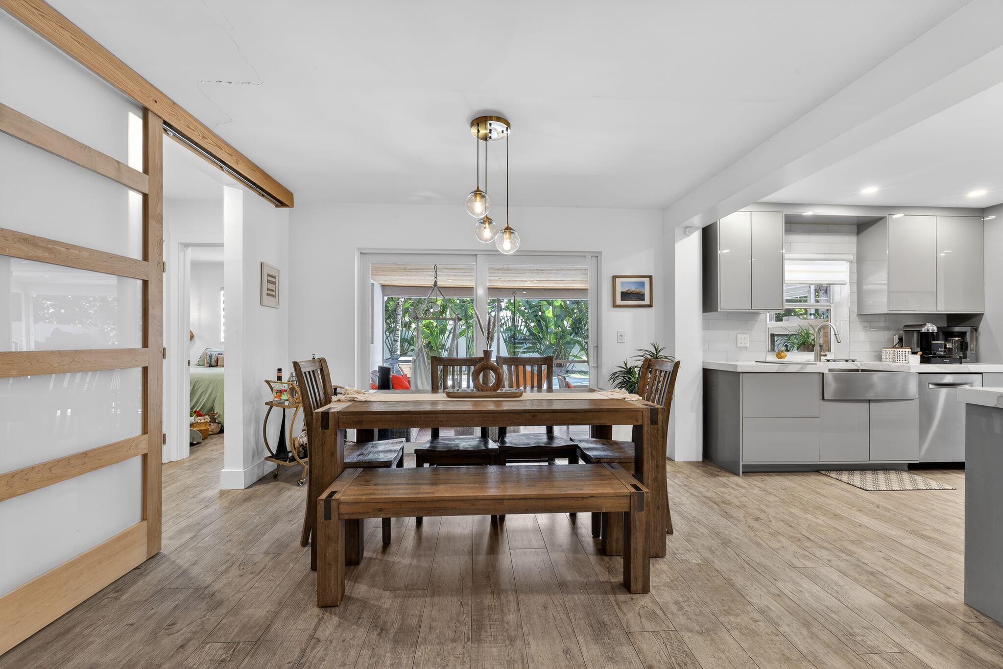 976 Southwest 11th Street Boca Raton, FL 33486 - Photo 16 of 29 a dining room with furniture window and wooden floor