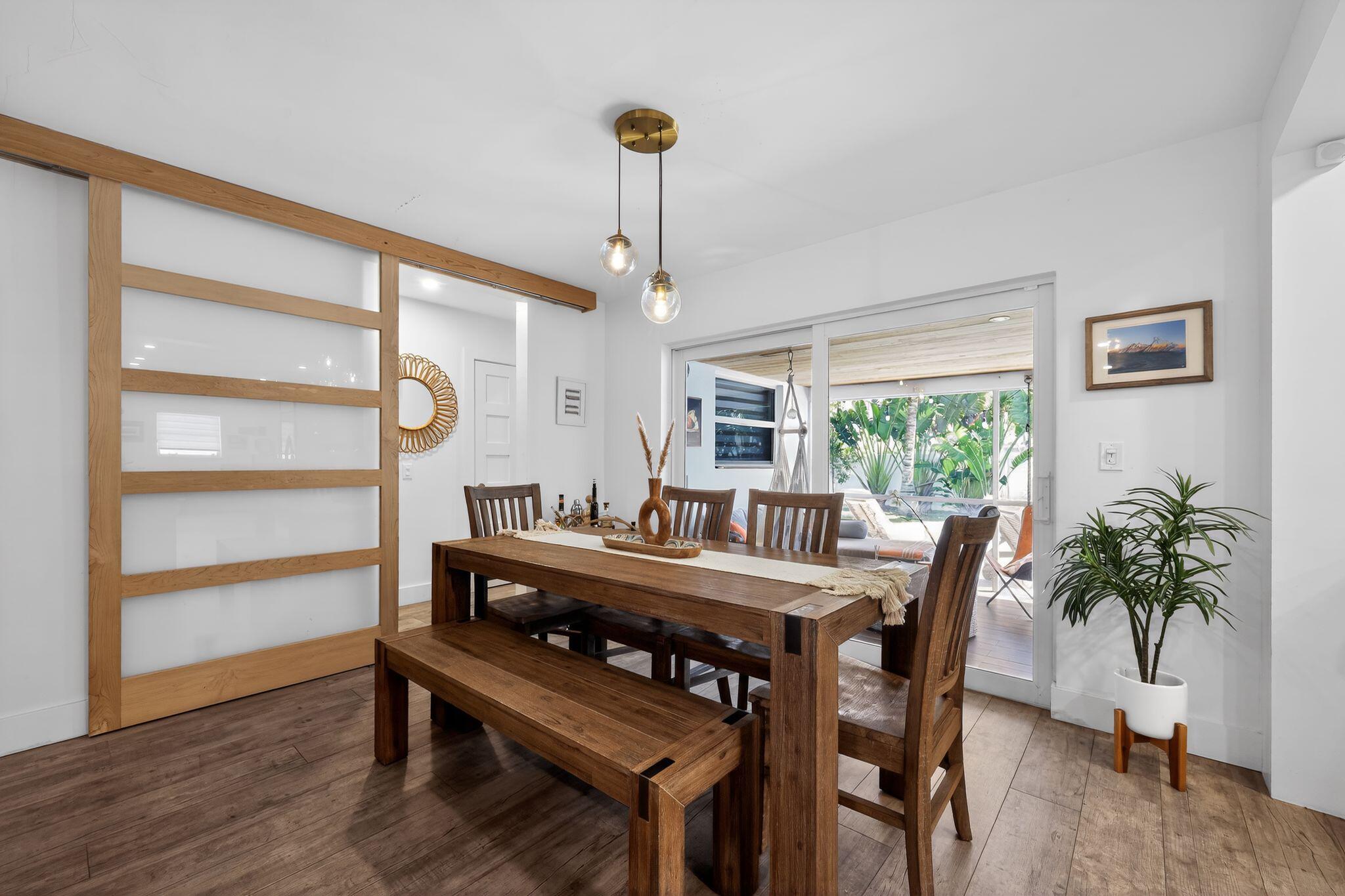 976 Southwest 11th Street Boca Raton, FL 33486 - Photo 18 of 29 a view of a dining room with furniture window and wooden floor