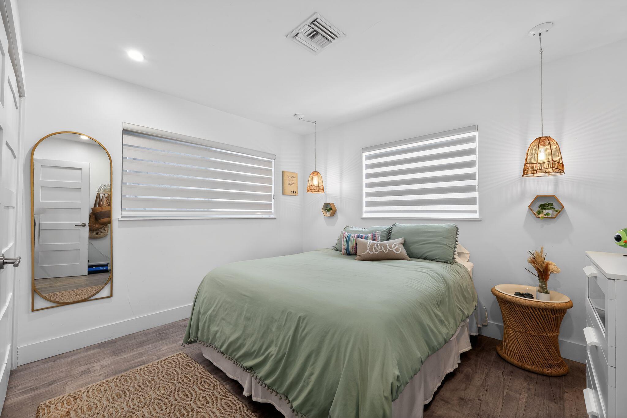 976 Southwest 11th Street Boca Raton, FL 33486 - Photo 23 of 29 a bedroom with a bed and a window