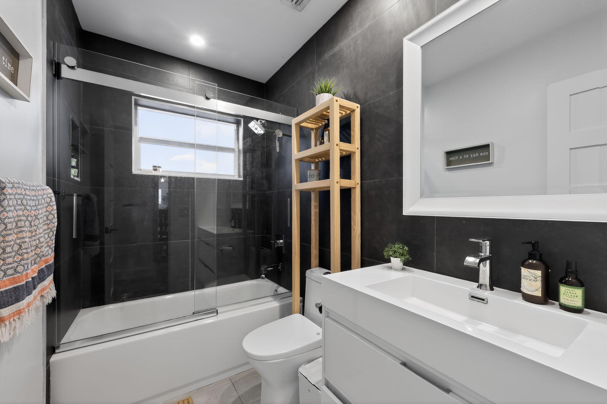 976 Southwest 11th Street Boca Raton, FL 33486 - Photo 24 of 29 a bathroom with a sink toilet and shower