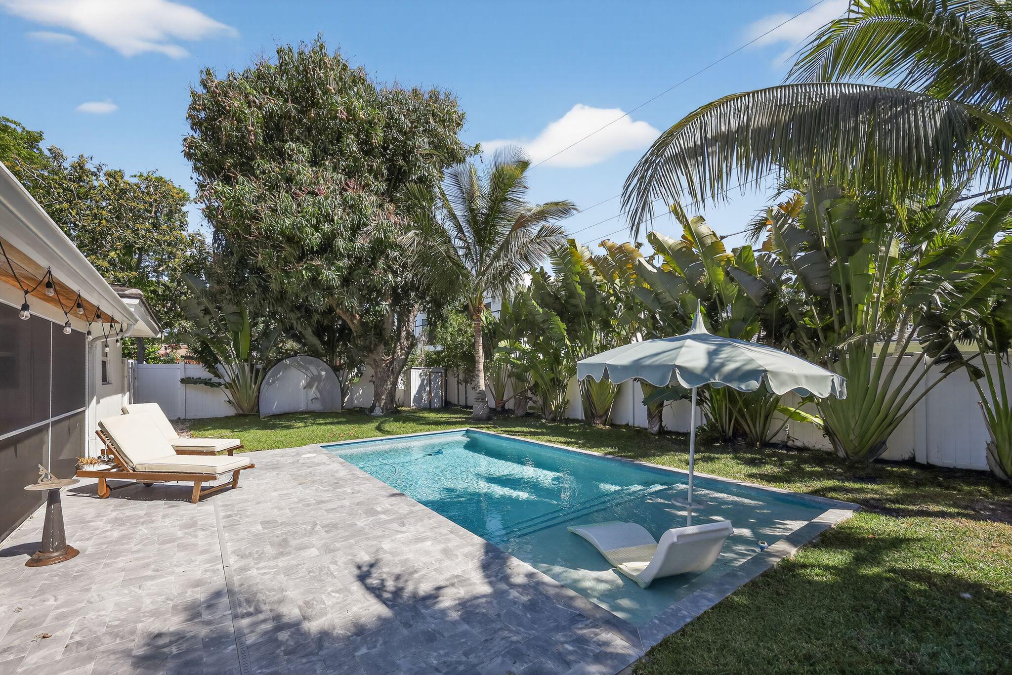 976 Southwest 11th Street Boca Raton, FL 33486 - Photo 4 of 29 a view of a backyard with a patio