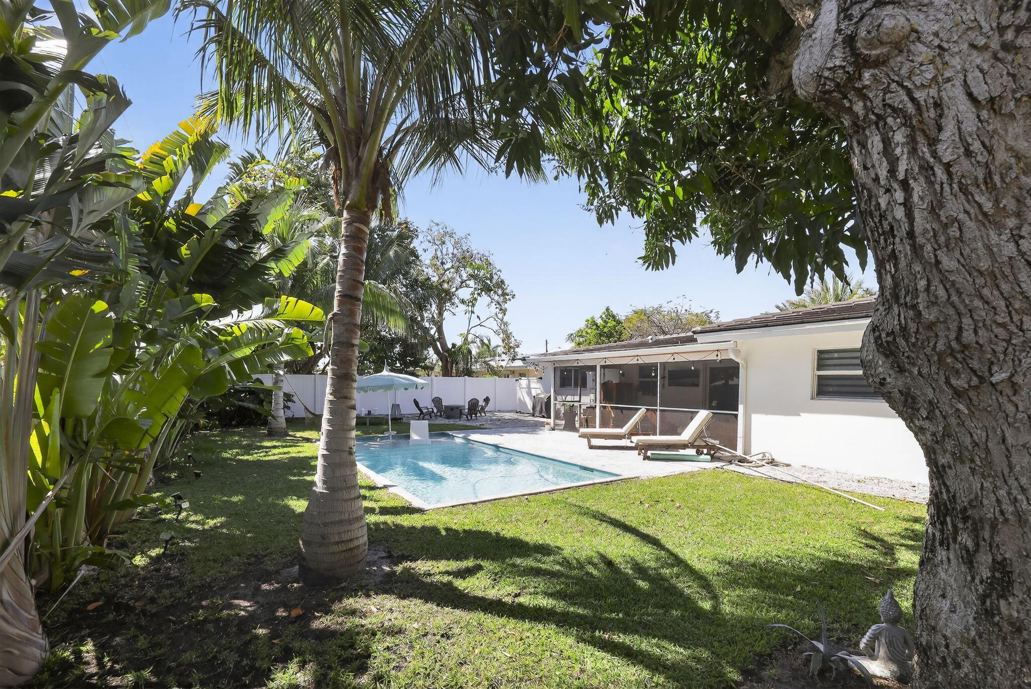 976 Southwest 11th Street Boca Raton, FL 33486 - Photo 7 of 29 a view of a backyard with a patio