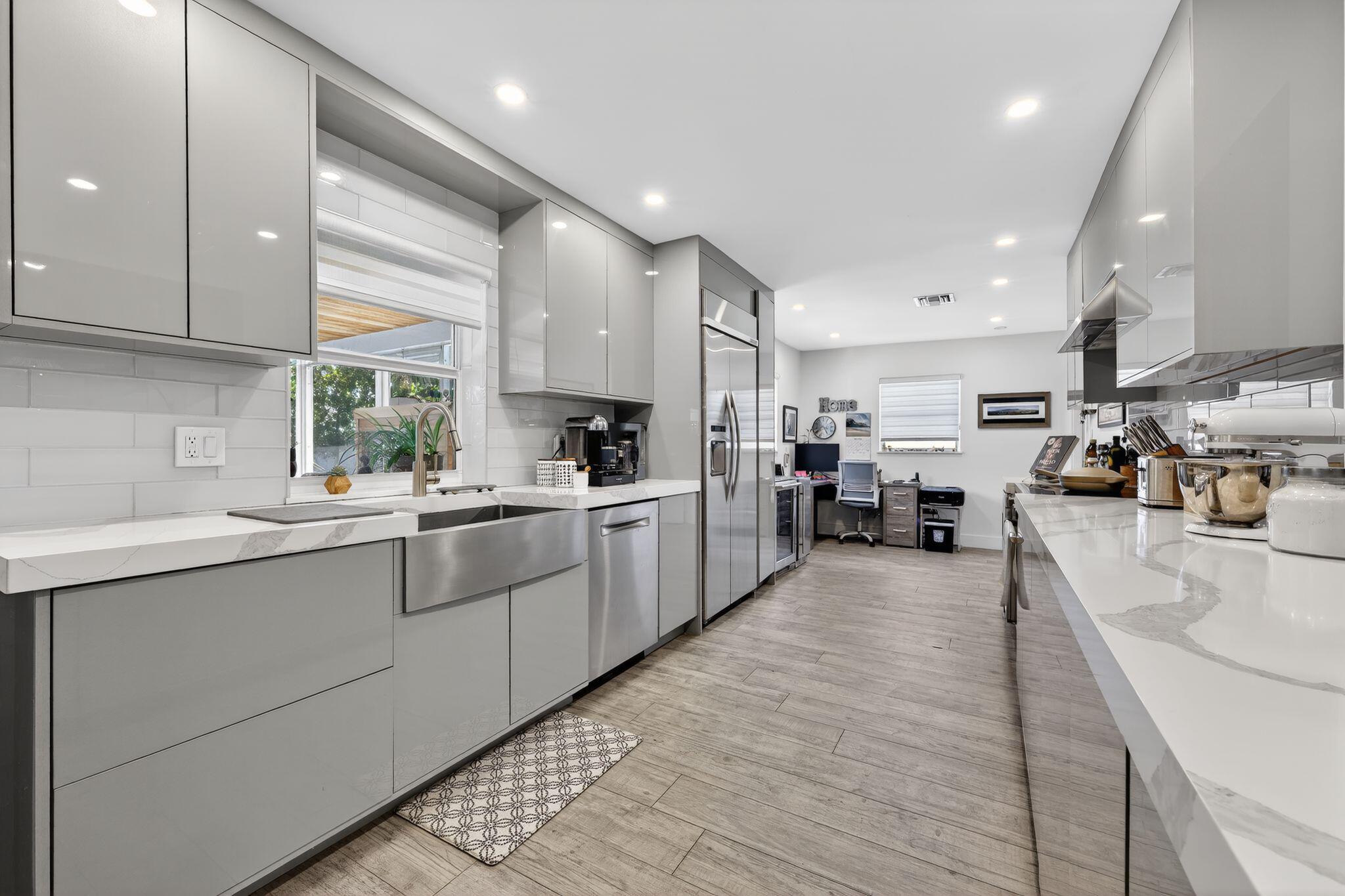 976 Southwest 11th Street Boca Raton, FL 33486 - Photo 9 of 29 a kitchen with stainless steel appliances granite countertop lots of counter top space