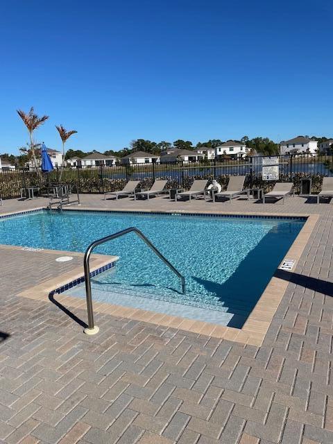 6000 Southeast Sky Blue Circle Stuart, FL 34997 - Photo 13 of 18 community pool on the lake