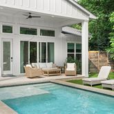 a roof deck with a table and chairs