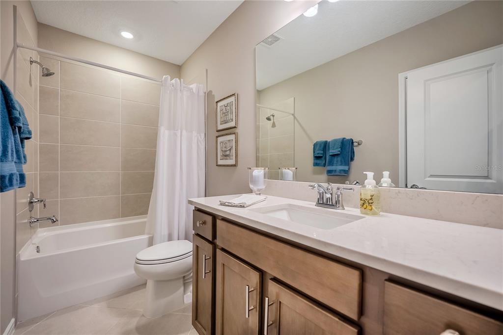 8344 Southwest 54th Loop Ocala, FL 34481 - Photo 17 of 36 a bathroom with a granite countertop sink toilet and shower