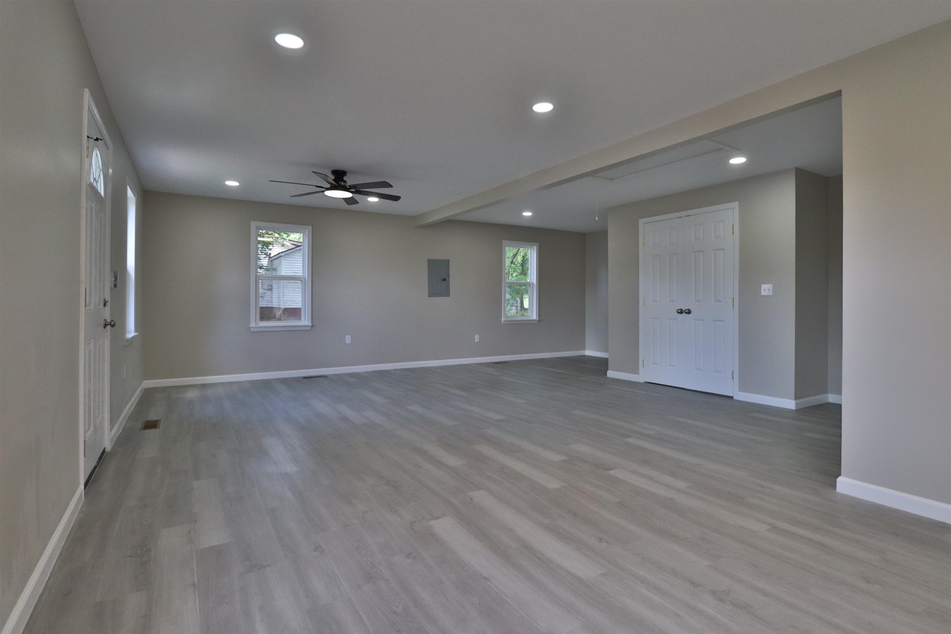 224 Kellar Avenue Ripley, TN 38063 - Photo 4 of 30 an empty room with wooden floor and windows