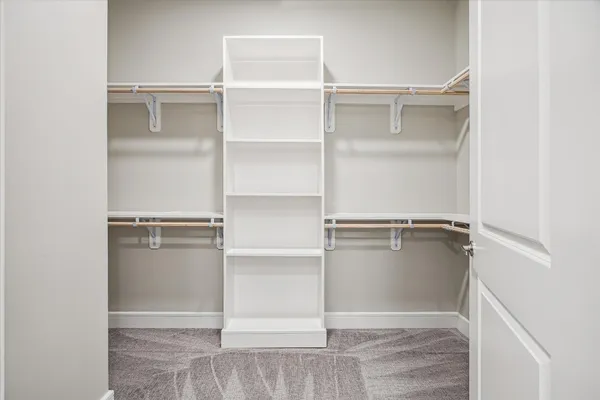 a view of an empty walk in closet