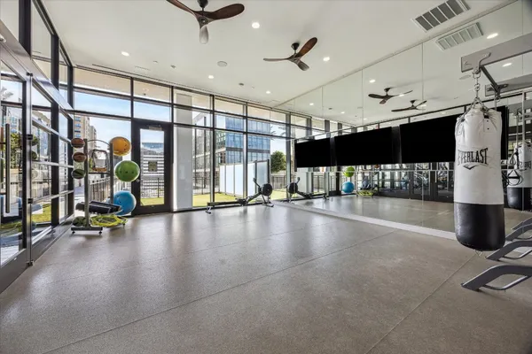 a view of a gym with gym equipment