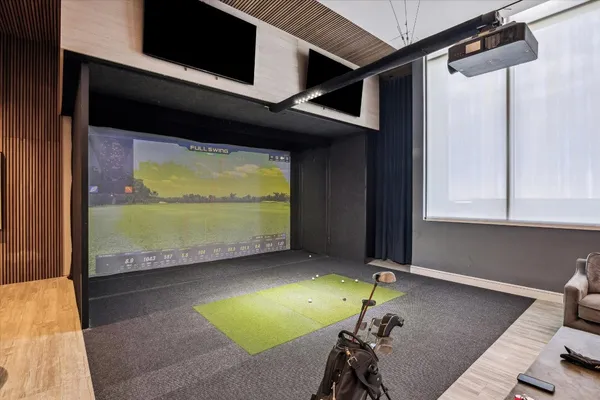a room with pool table and a floor to ceiling window
