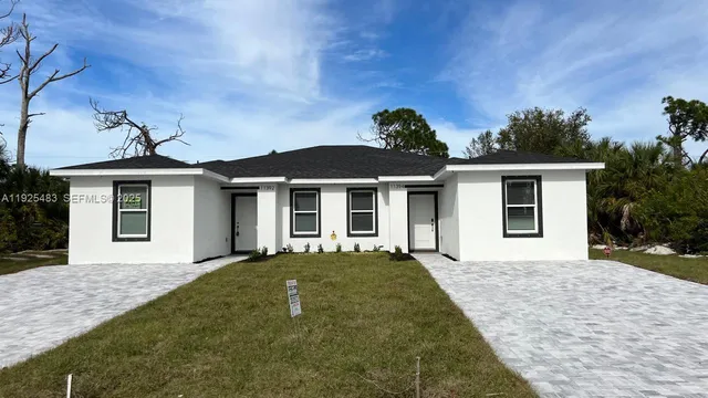 front view of a house with a yard