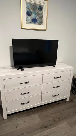 a bathroom with a toilet and a bathtub