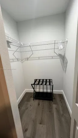 a bedroom with a bed and a table