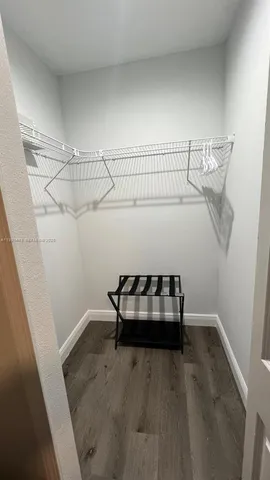 a bedroom with a bed and a table