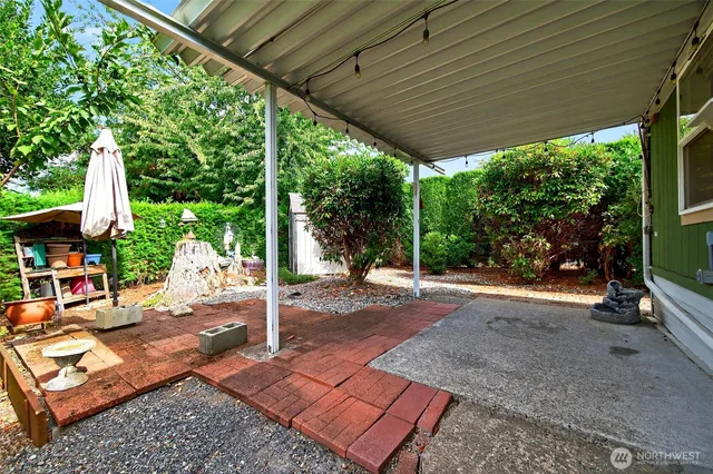 a view of a backyard with sitting area