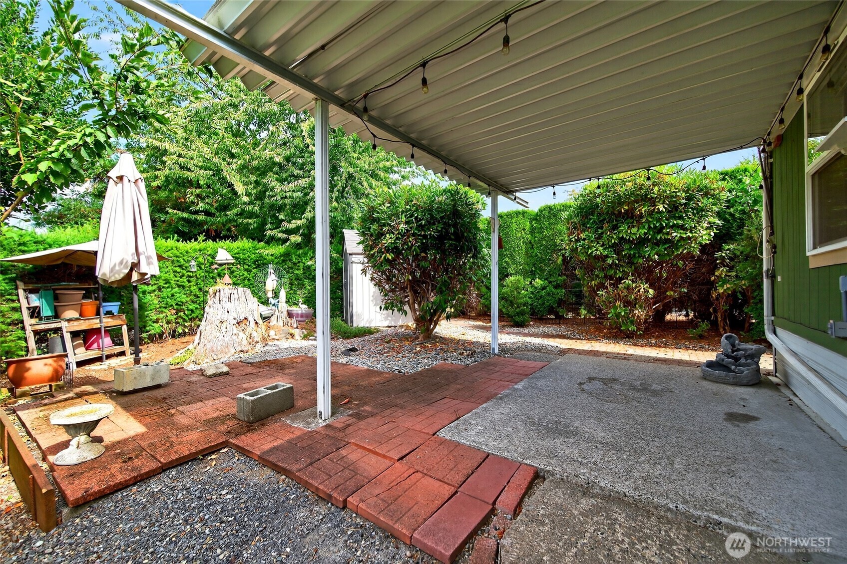 23825 15th Avenue Southeast, Unit 93 Bothell, WA 98021 - Photo 14 of 34 a view of a backyard with sitting area