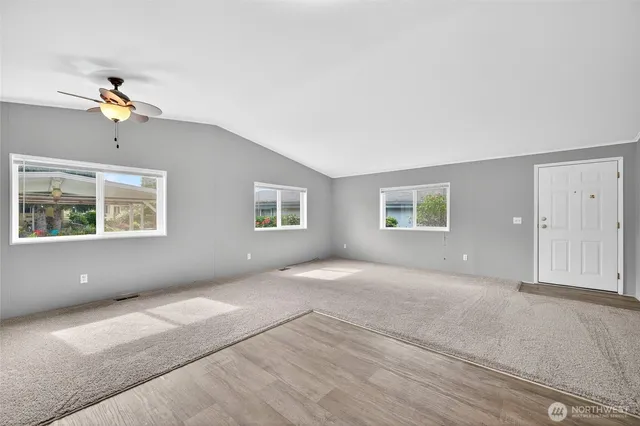 a view of an empty room with a window