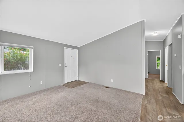 a view of an empty room with a window