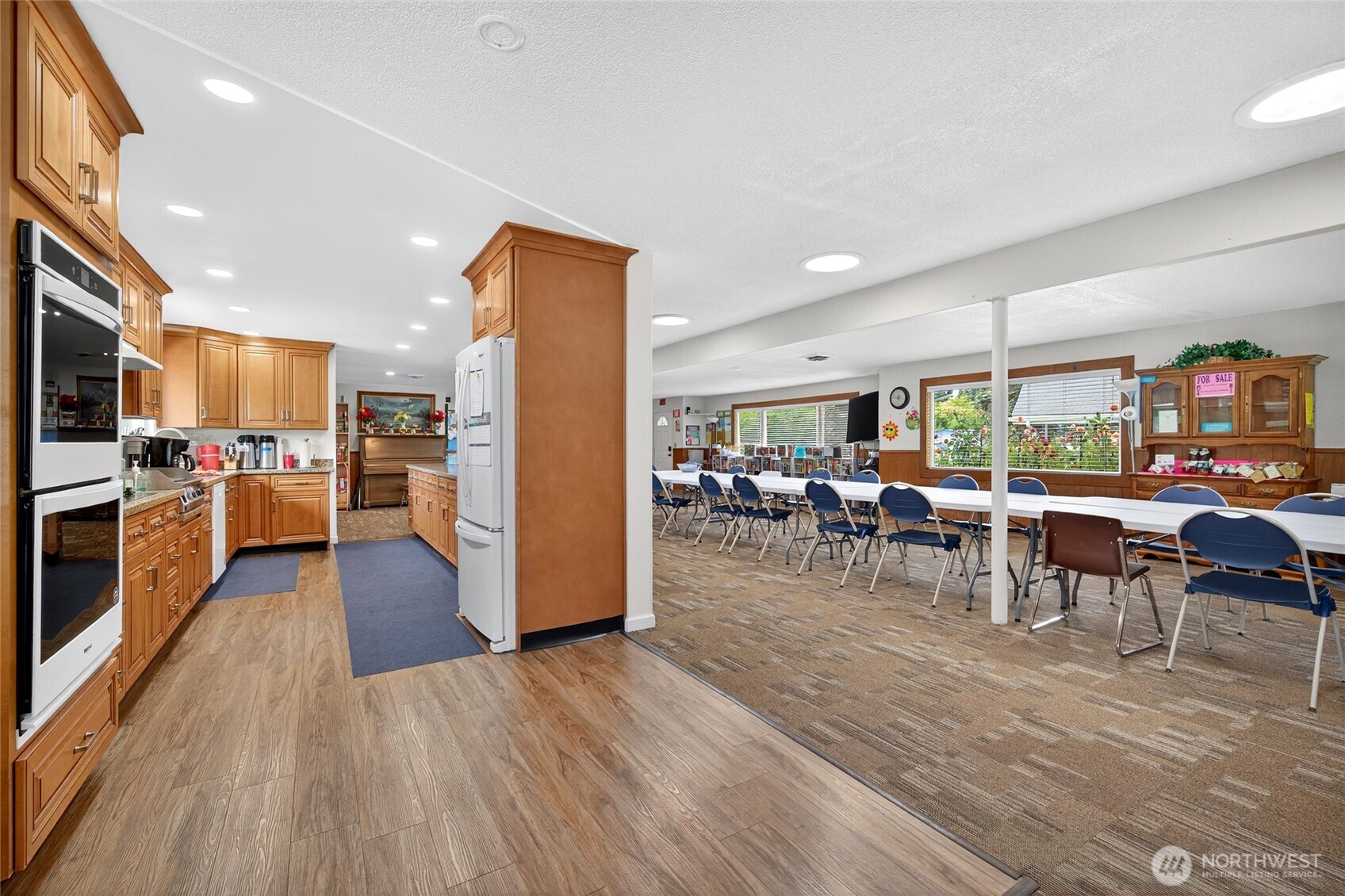 23825 15th Avenue Southeast, Unit 93 Bothell, WA 98021 - Photo 30 of 34 a view of a dining room and livingroom with furniture wooden floor