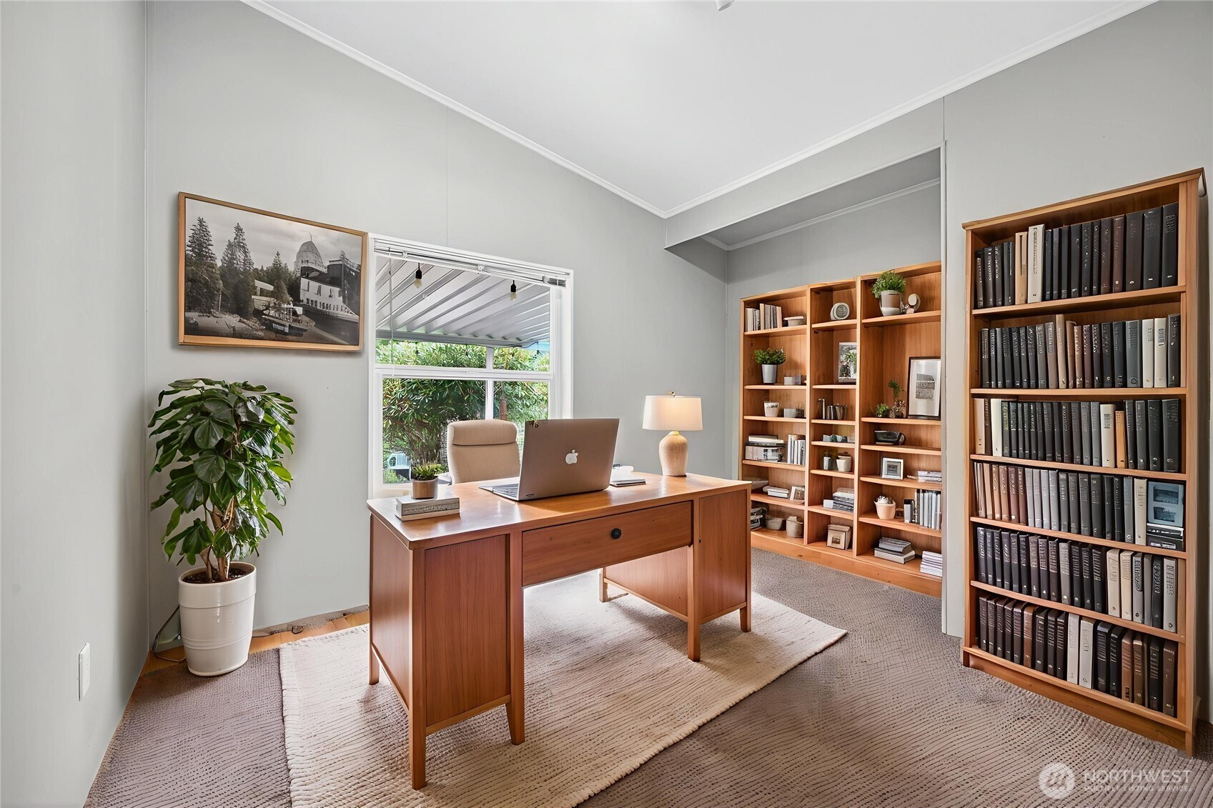 23825 15th Avenue Southeast, Unit 93 Bothell, WA 98021 - Photo 10 of 34 a view of a workspace with furniture and bookshelf