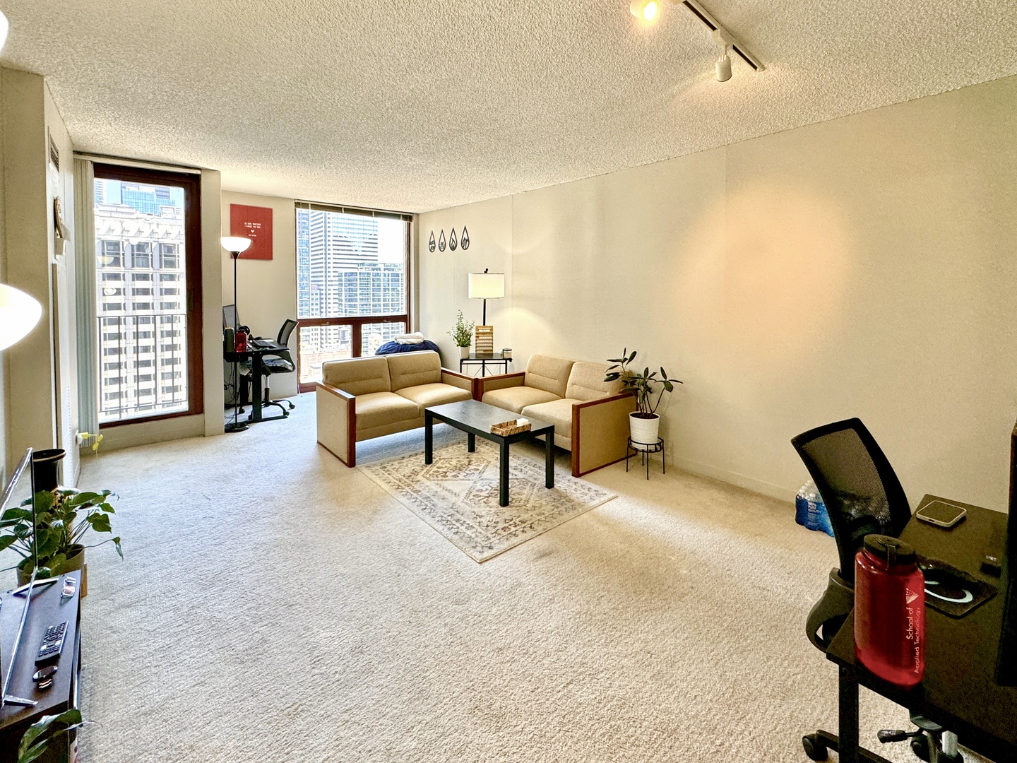 200 North Dearborn Street, Unit 2605 Chicago, IL 60601 - Photo 3 of 22 a living room with furniture and a window