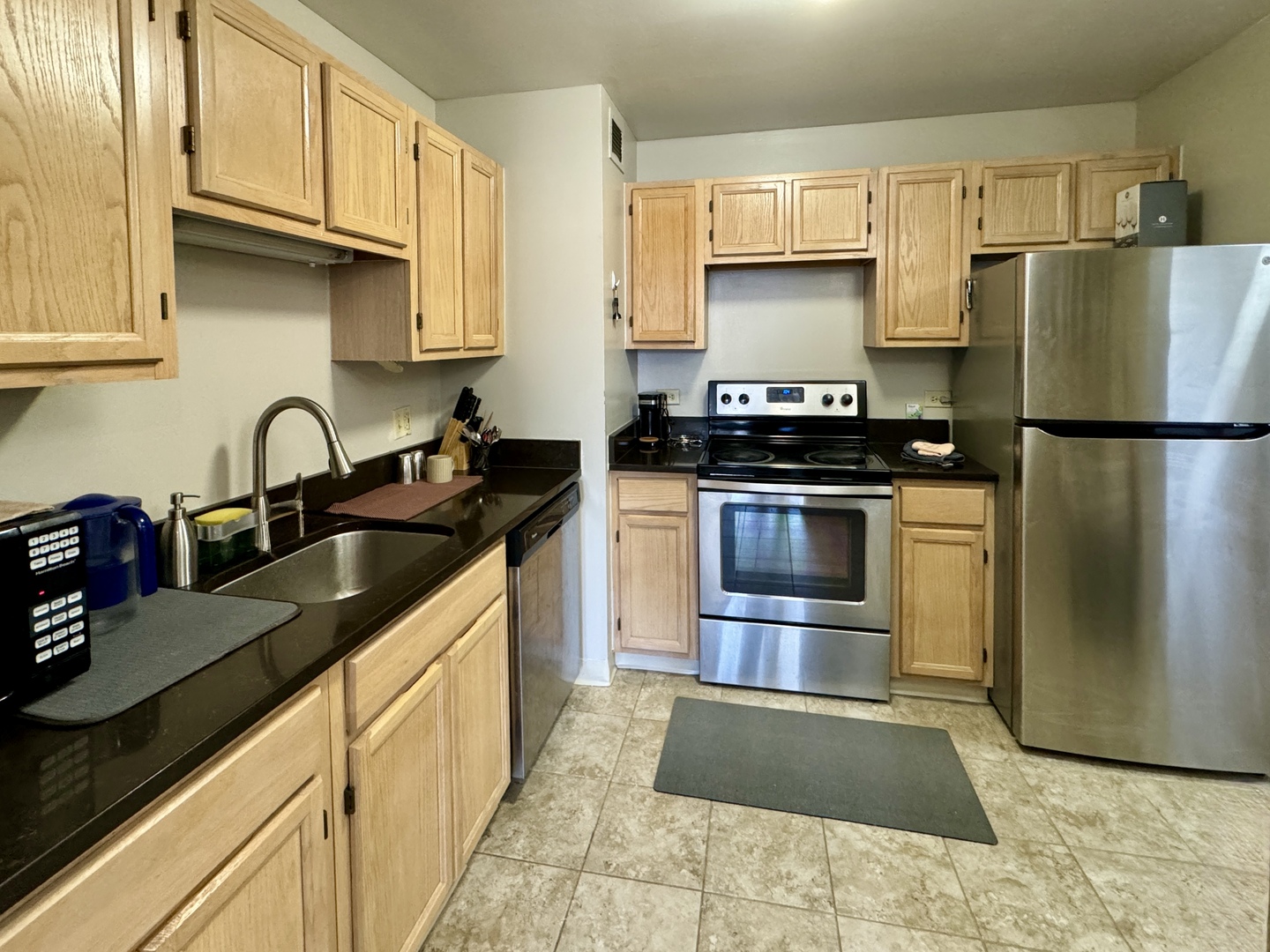 200 North Dearborn Street, Unit 2605 Chicago, IL 60601 - Photo 8 of 22 a kitchen with a sink stove and refrigerator