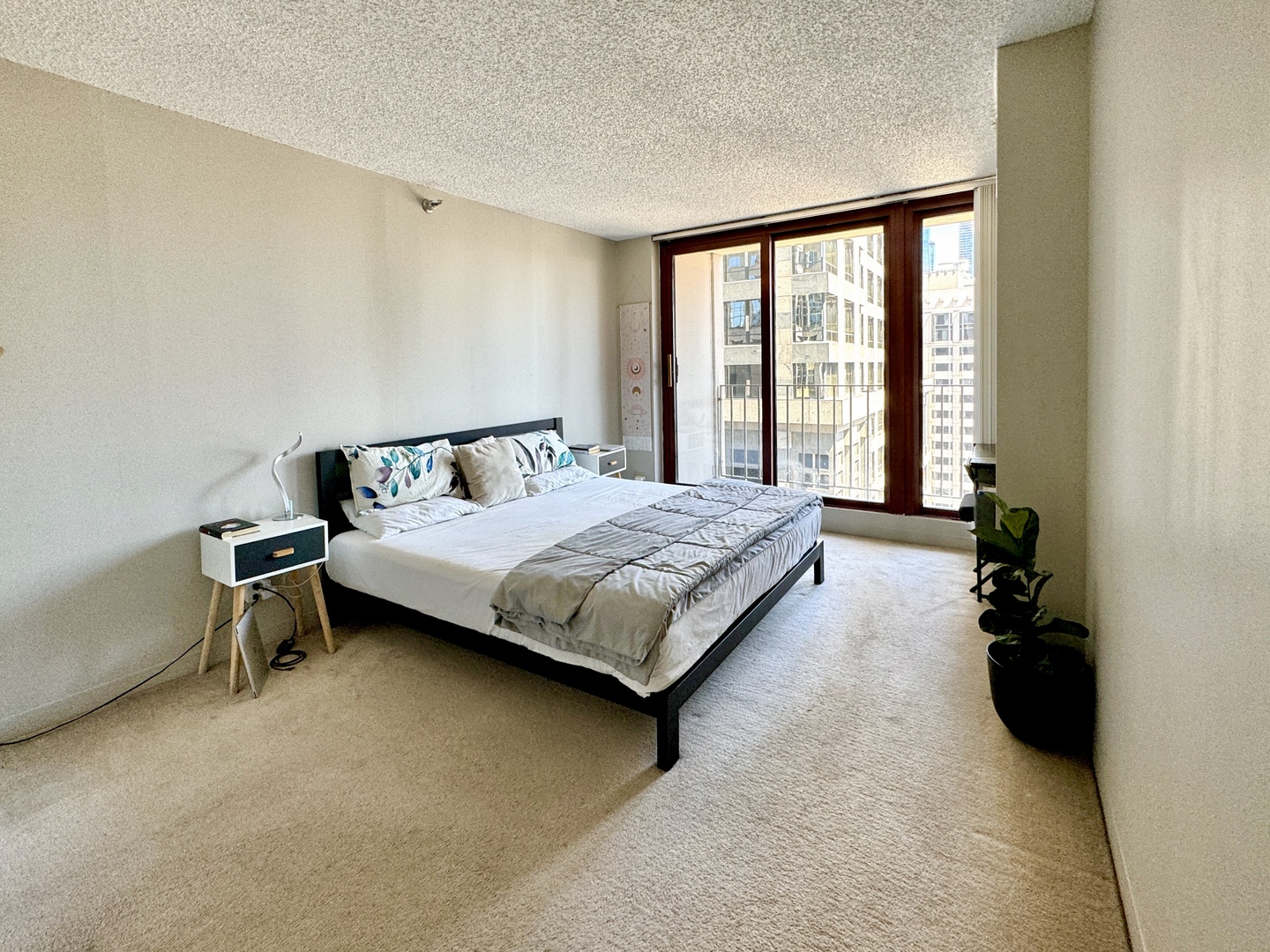 200 North Dearborn Street, Unit 2605 Chicago, IL 60601 - Photo 9 of 22 a bedroom with a bed and a window