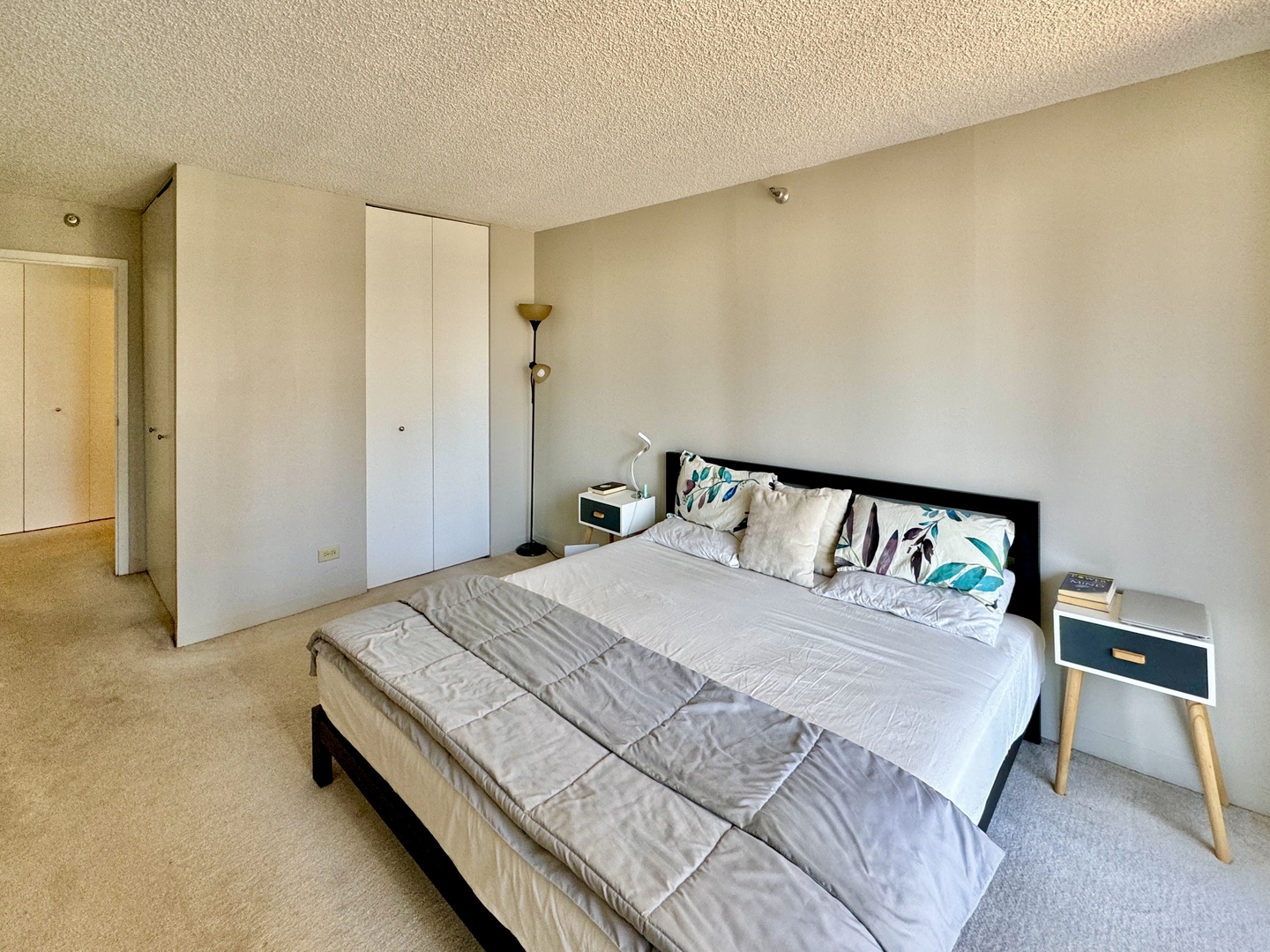 200 North Dearborn Street, Unit 2605 Chicago, IL 60601 - Photo 10 of 22 a bedroom with a bed and painting on the wall