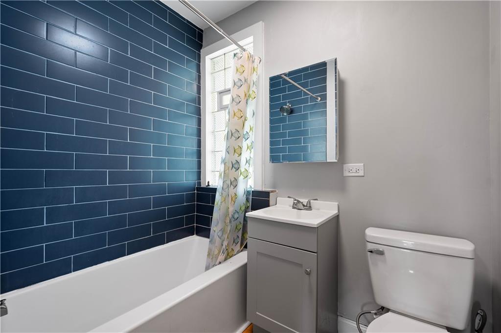 243 Castle Shannon Boulevard, Unit 243 Pittsburgh, PA 15228 - Photo 17 of 26 a bathroom with a sink toilet vanity and bathtub
