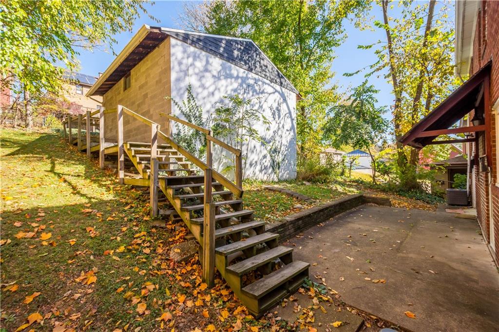 243 Castle Shannon Boulevard, Unit 243 Pittsburgh, PA 15228 - Photo 18 of 26 a backyard of a house with lots of green space