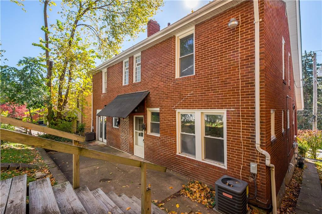 243 Castle Shannon Boulevard, Unit 243 Pittsburgh, PA 15228 - Photo 21 of 26 a view of a house with a yard
