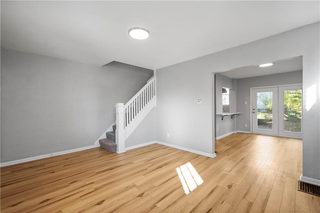 243 Castle Shannon Boulevard, Unit 243 Pittsburgh, PA 15228 - Photo 3 of 26 a view of a livingroom with wooden floor