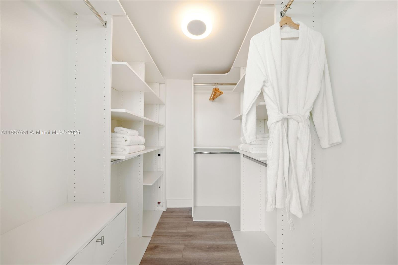 185 Southwest 7th Street, Unit 803 Miami, FL 33130 - Photo 23 of 25 a view of a bathroom with a sink and shower