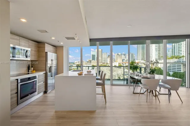 a spacious bedroom with a large bed and a large window