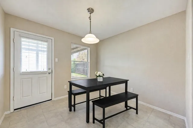 a view of a livingroom with furniture and window