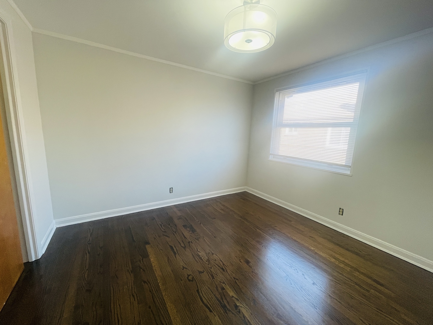 Undisclosed Address Oak Park, IL 60302 - Photo 12 of 15 an empty room with wooden floor and windows