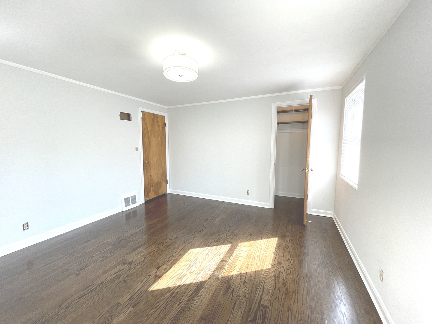 Undisclosed Address Oak Park, IL 60302 - Photo 13 of 15 an empty room with wooden floor and windows
